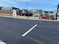 Freshly paved town street intersection